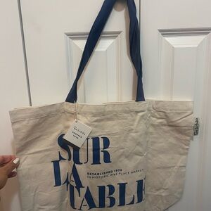 Sur La Table Cream Tote with Blue Design in regular size. Brand new with tags.